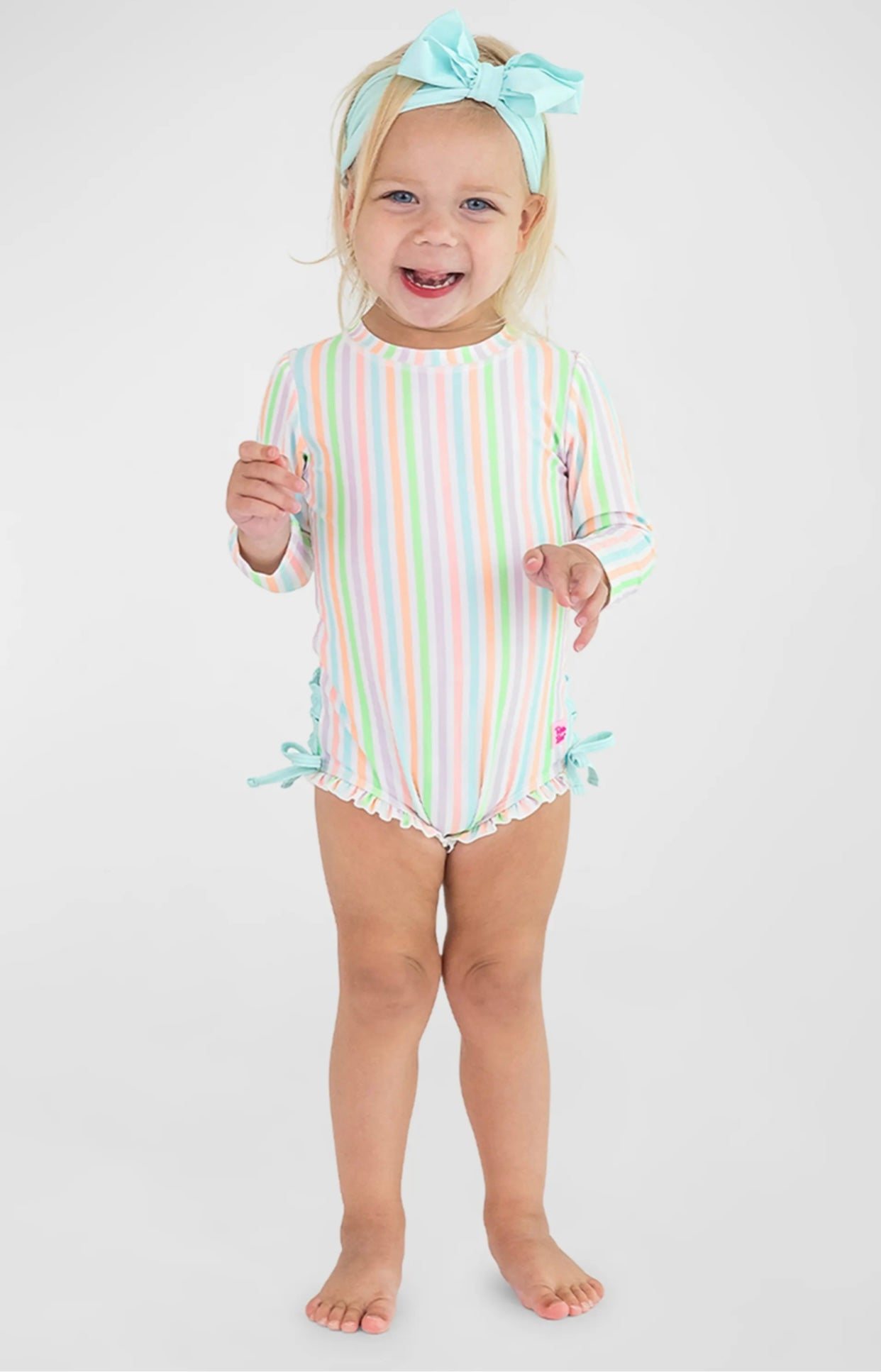 Ruffle Butts Pale Rainbow Stripe LS One Piece Rashguard